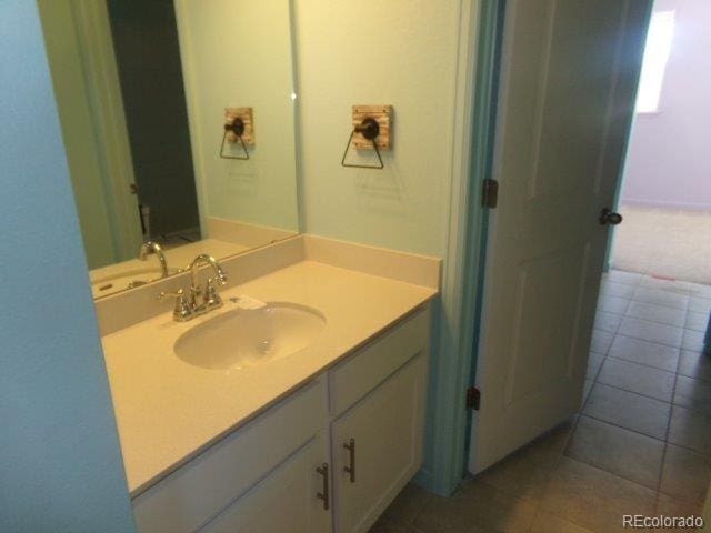 bathroom featuring vanity and tile patterned flooring