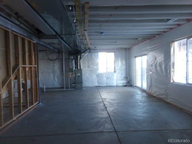 basement with heating unit and a wealth of natural light