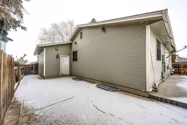 rear view of house with a patio and a fenced backyard