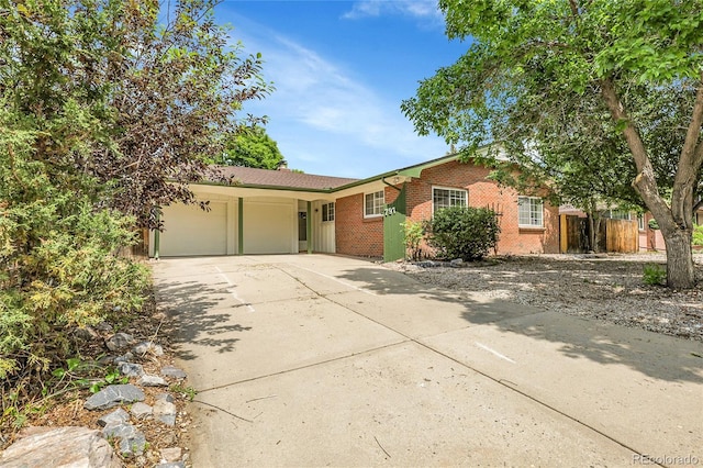 797 W Briarwood Ave, Littleton, CO 80120 - ranch-style house with brick siding, an attached garage, and concrete driveway