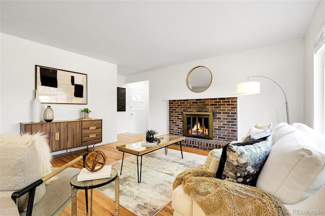 797 W Briarwood Ave, Littleton, CO 80120 - living area with light wood-type flooring and a brick fireplace