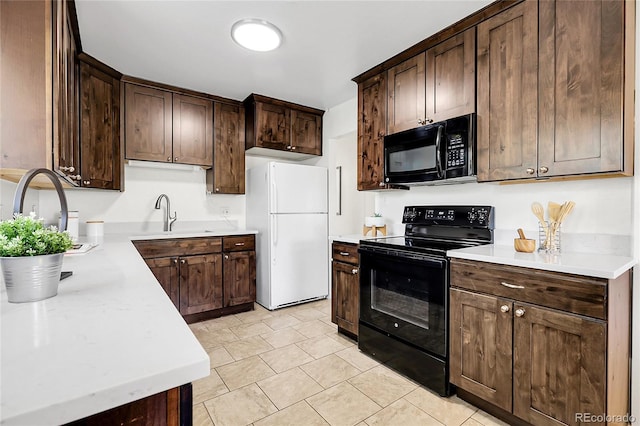 797 W Briarwood Ave, Littleton, CO 80120 - kitchen with black appliances, a sink, dark brown cabinetry, and light countertops