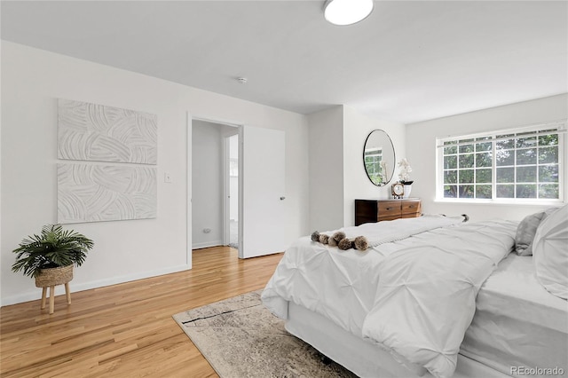 797 W Briarwood Ave, Littleton, CO 80120 - bedroom featuring light wood-style floors and baseboards