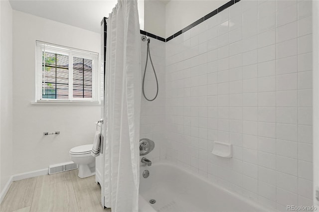 797 W Briarwood Ave, Littleton, CO 80120 - bathroom featuring shower / bathtub combination with curtain, toilet, and baseboards