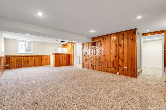 797 W Briarwood Ave, Littleton, CO 80120 - basement featuring wood walls, recessed lighting, carpet flooring, and a wainscoted wall