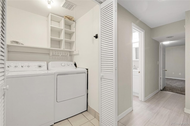 797 W Briarwood Ave, Littleton, CO 80120 - washroom with washing machine and dryer and baseboards