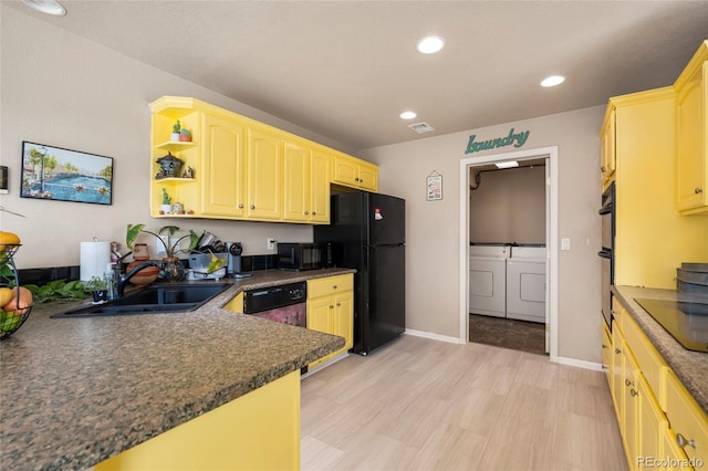 20414 E 55th Pl, Denver, CO 80249 - kitchen with separate washer and dryer, black appliances, a sink, dark countertops, and open shelves