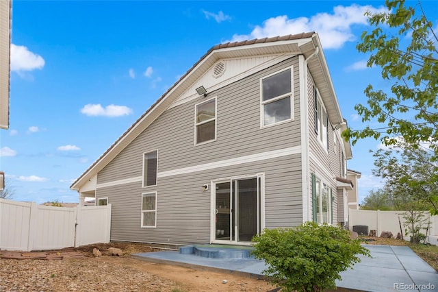 20414 E 55th Pl, Denver, CO 80249 - back of house with a patio area, a fenced backyard, and central air condition unit