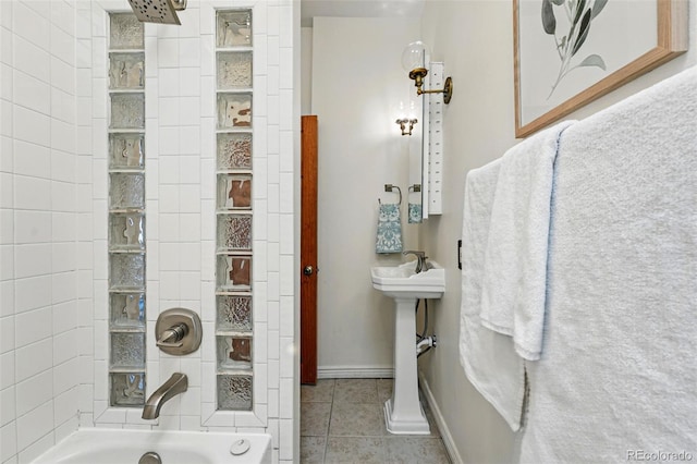 full bath featuring tile patterned floors, bathing tub / shower combination, and baseboards