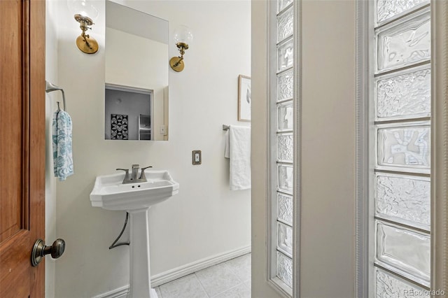bathroom featuring tile patterned floors and baseboards