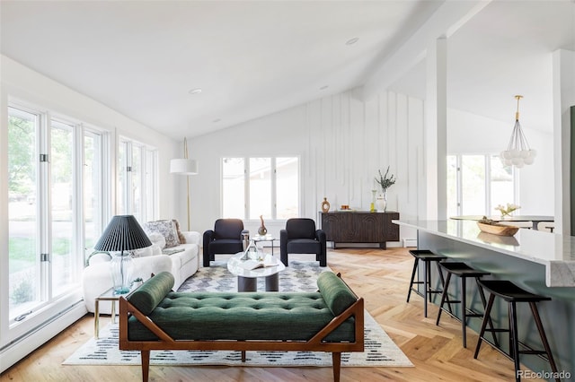 living room featuring a baseboard radiator, lofted ceiling, plenty of natural light, and light parquet flooring