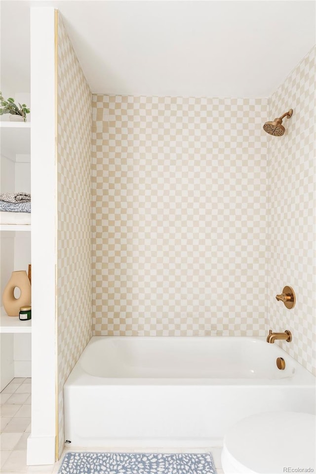 bathroom with toilet,  shower combination, and tile patterned floors