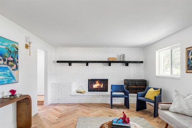 living area featuring light parquet floors and a fireplace