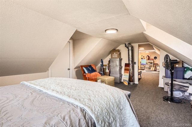 bedroom featuring carpet, a textured ceiling, and lofted ceiling