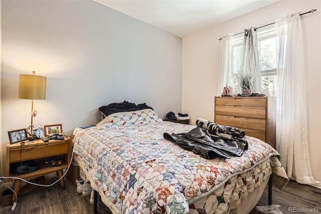 bedroom featuring wood finished floors