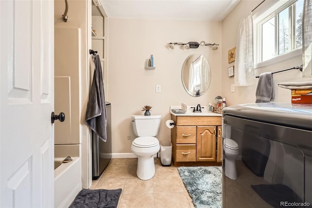 full bathroom featuring toilet, baseboards, tile patterned flooring, vanity, and shower / bathing tub combination