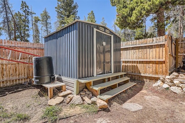 view of shed featuring a fenced backyard