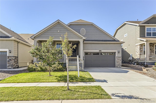 craftsman-style house featuring a garage and a front lawn