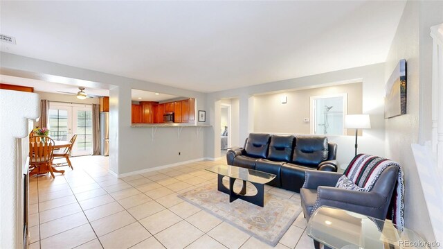 7270 Marmot Ridge Pl, Littleton, CO 80125 - living area featuring light tile patterned floors and a ceiling fan