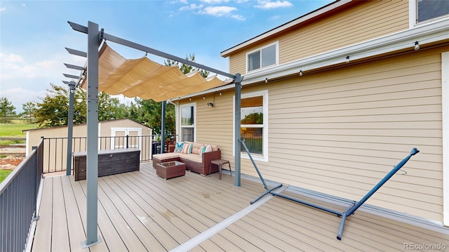 7270 Marmot Ridge Pl, Littleton, CO 80125 - wooden deck with a pergola, a storage unit, and an outdoor hangout area