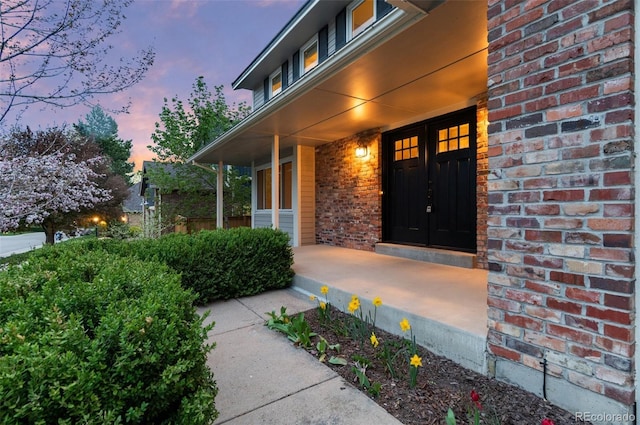 8132 Lodgepole Trl, Lone Tree, CO 80124 - entrance to property with brick siding and covered porch