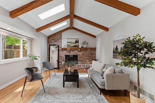 8132 Lodgepole Trl, Lone Tree, CO 80124 - living area with a skylight, wood finished floors, and a brick fireplace