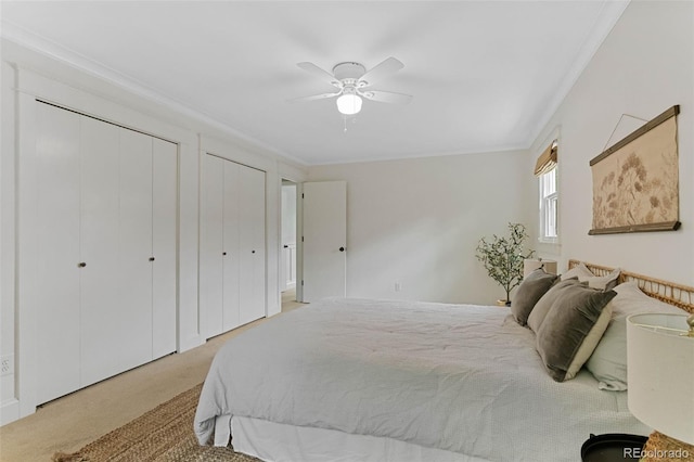 8132 Lodgepole Trl, Lone Tree, CO 80124 - bedroom with light carpet, two closets, ornamental molding, and ceiling fan