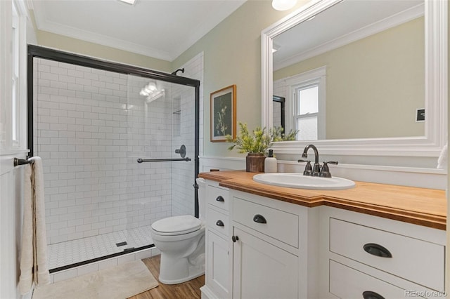 8132 Lodgepole Trl, Lone Tree, CO 80124 - full bath featuring vanity, a shower stall, crown molding, and wood finished floors
