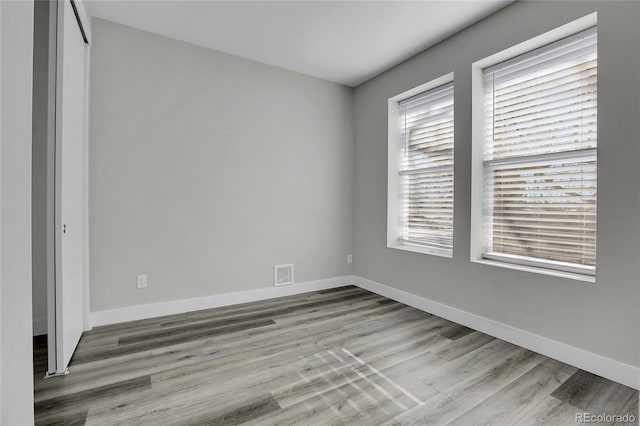 unfurnished room featuring light wood-type flooring