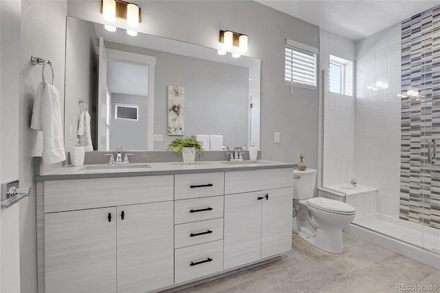 bathroom featuring vanity, toilet, and walk in shower