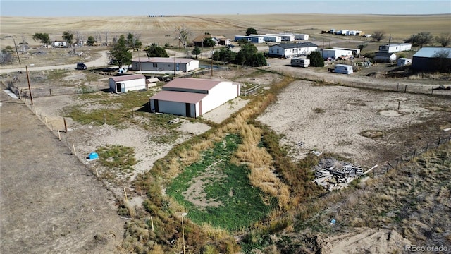 birds eye view of property featuring a rural view