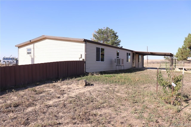 215 7th Ave, Deer Trail, CO 80105 - view of property exterior with an attached carport
