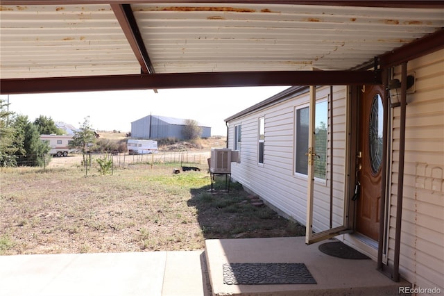 215 7th Ave, Deer Trail, CO 80105 - view of yard with central AC and a patio