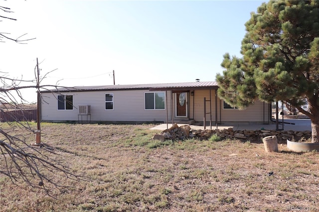 215 7th Ave, Deer Trail, CO 80105 - rear view of property featuring a patio area