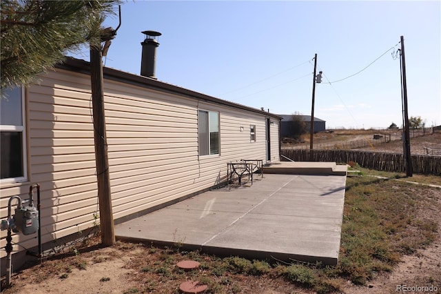 215 7th Ave, Deer Trail, CO 80105 - view of side of property featuring a patio