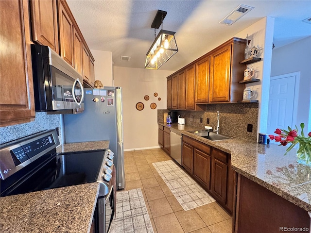 kitchen featuring visible vents, stainless steel appliances, open shelves, a sink, and light tile patterned flooring