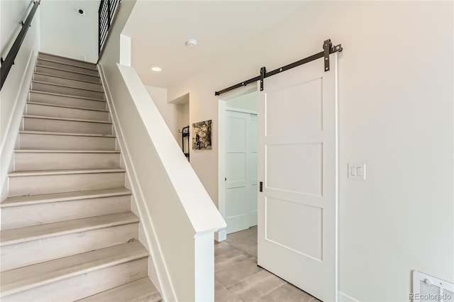 4100 E Iliff Ave Unit 4, Denver, CO 80222 - stairs featuring a barn door and recessed lighting