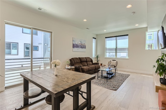 4100 E Iliff Ave Unit 4, Denver, CO 80222 - living area featuring light wood-style floors, recessed lighting, and baseboards