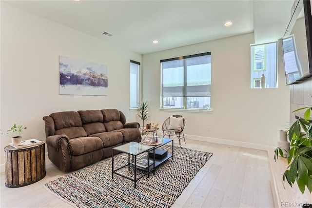 4100 E Iliff Ave Unit 4, Denver, CO 80222 - living room featuring light wood-type flooring, recessed lighting, and baseboards