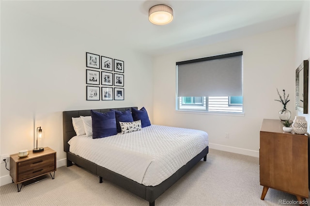 4100 E Iliff Ave Unit 4, Denver, CO 80222 - bedroom with baseboards and light carpet