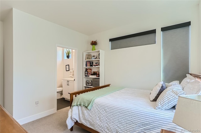 4100 E Iliff Ave Unit 4, Denver, CO 80222 - carpeted bedroom featuring baseboards and ensuite bath