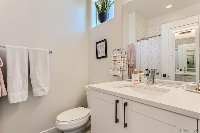 4100 E Iliff Ave Unit 4, Denver, CO 80222 - bathroom featuring toilet, a shower with curtain, and vanity