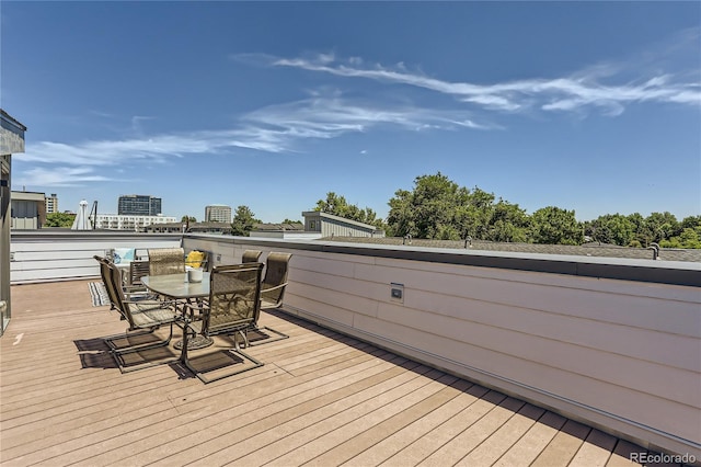 4100 E Iliff Ave Unit 4, Denver, CO 80222 - wooden deck with outdoor dining area