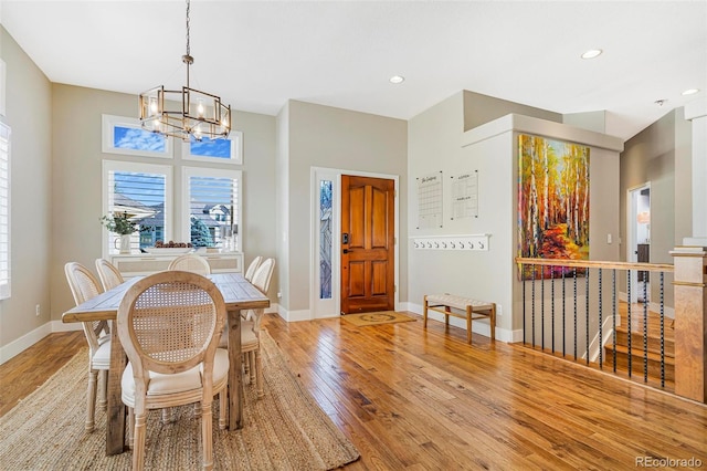 dining room featuring a chandelier and light wood-type flooring