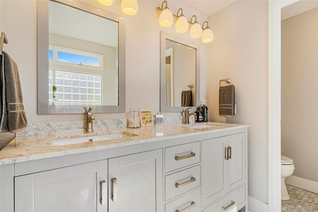 bathroom featuring vanity and toilet