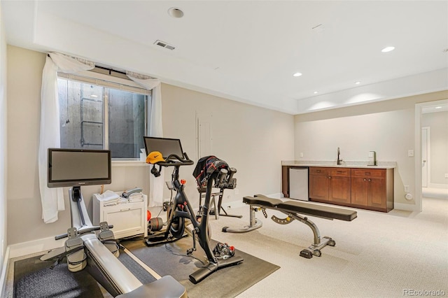 workout area with light colored carpet