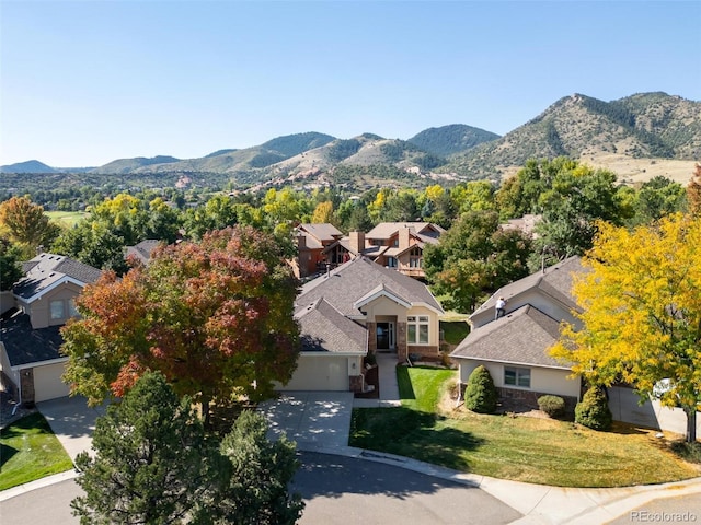 birds eye view of property with a mountain view