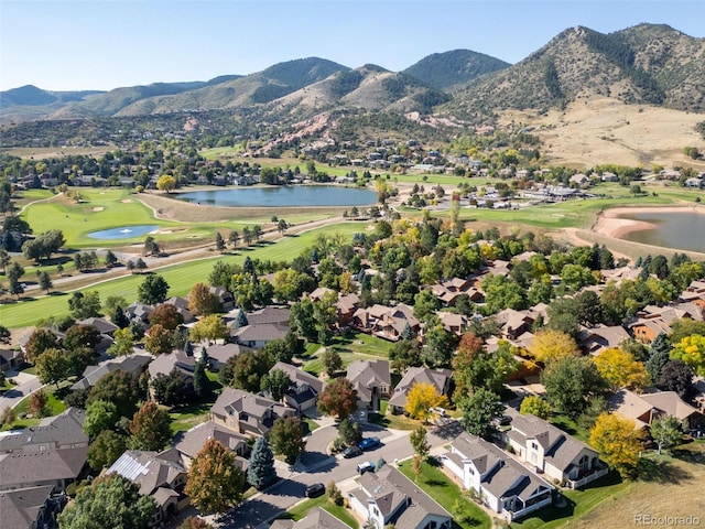 aerial view featuring a water and mountain view