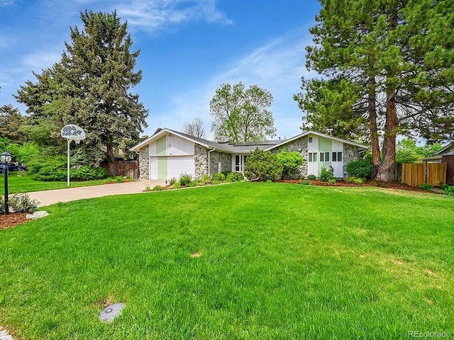 461 Nome St, Aurora, CO 80010 - mid-century modern home with stone siding, concrete driveway, and a garage