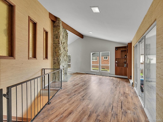 461 Nome St, Aurora, CO 80010 - empty room with wood finished floors and baseboard heating